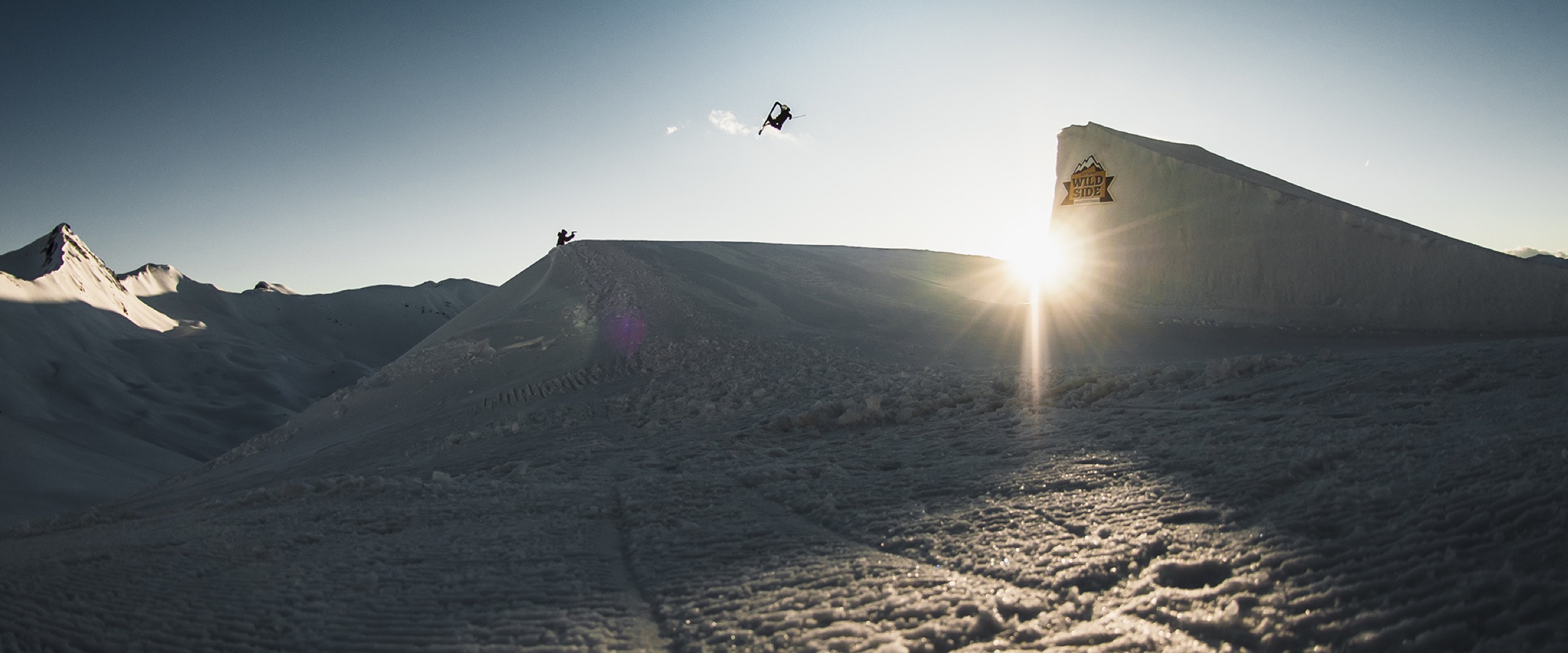 Bartek Sibiga freestyle ski jump at golden hour in Livigno